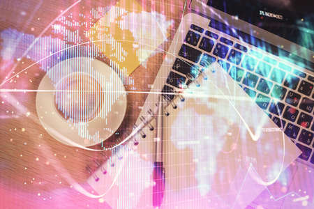 Business theme hologram drawings over computer on the desktop background. Top view. Multi exposure. Concept of international connections.の写真素材