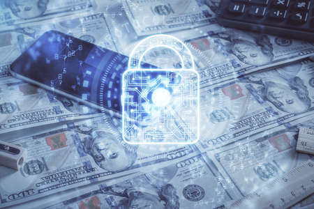 Double exposure of lock drawing over us dollars bill background. Security safe concept.の写真素材