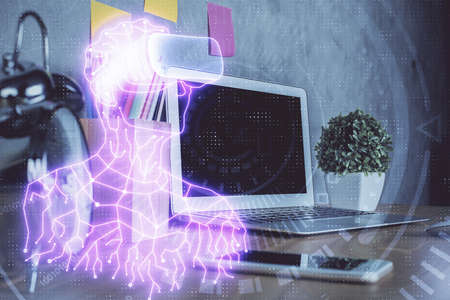 Computer on desktop with AR theme icon. Multi exposure. Concept of augmented reality.の写真素材