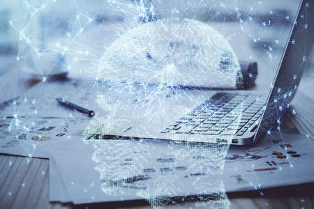 Multi exposure of work table with computer and brain hologram. Brainstorm concept.