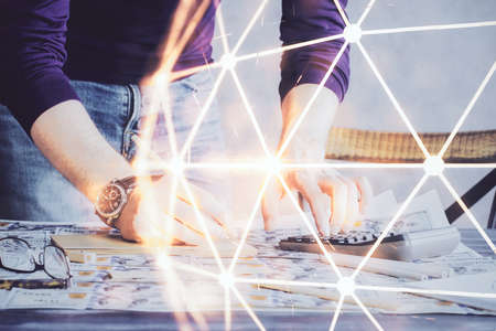 Man's hands working with notes background. Social networking concept. Crowd sourcing. Global business. Multi exposure.の写真素材