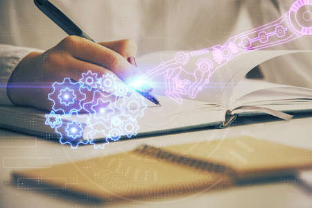 Multi exposure of writing hand on background with data technology hologram. Concept of innovation.