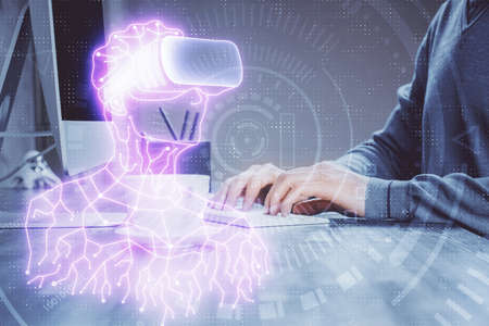 AR hologram with man working on computer on background. Augmented reality concept. Double exposure.