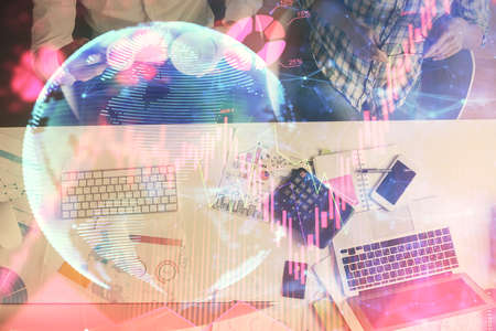 Double exposure of man and woman working together and business theme hologram drawing. Computer...