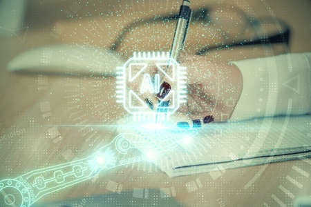 Multi exposure of woman's writing hand on background with data technology hud. Concept of innovation.の写真素材