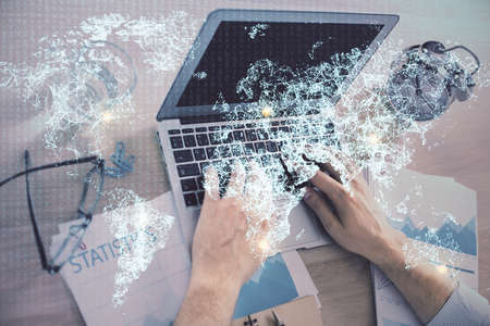 Social network theme hologram with businessman working on computer on background. Concept of world...