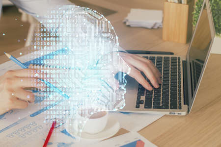 Businessman with computer background with brain theme hologram. Concept of brainstorm. Multi exposure.の写真素材