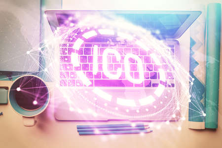 Blockchain theme hologram drawings over computer on the desktop background. Top view. Multi...