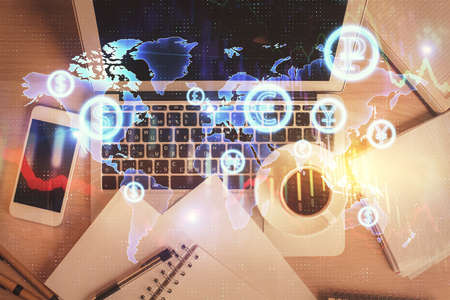 Stock market chart and top view computer on the table background. Double exposure. Concept of...