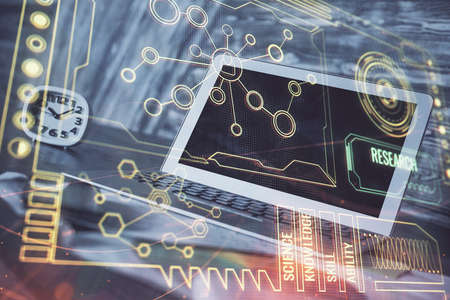 Double exposure of laptop computer and technology theme hologram. Concept of freelance work.