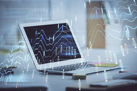 Forex Chart hologram on table with computer background. Multi exposure. Concept of financial...