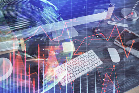 Multi exposure of graph and financial info and work space with computer background. Concept of...