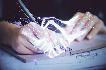 Handshake drawing over hands taking notes background. Concept of success. Double exposureの写真素材