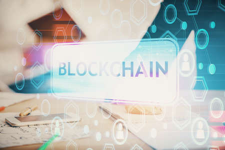 Double exposure of blockchain theme drawing over people taking notes background. Concept of cryptocurrencyの写真素材