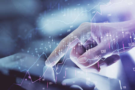Multi exposure of man's hands holding and using a digital phone and forex graph drawing. Financial market concept.の写真素材