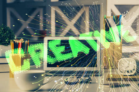 Desktop computer background in office and start up theme hologram drawing. Double exposure. Startup concept.の写真素材