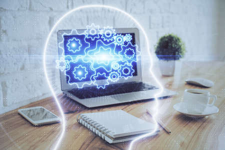 Multi exposure of work space with computer and human brain hologram. Brainstorm concept.の写真素材
