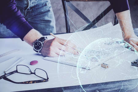 Man's hands working with notes background. Social networking concept. Crowd sourcing. Global business. Multi exposure.の写真素材