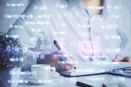 Man with mathematical and scientific formulas. Concepts of education. Symbols and equations on a...