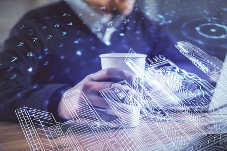 High tech city drawing with businessman working on computer on background. Smartcity concept. Double...