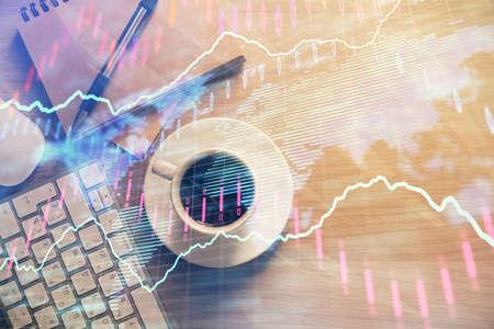Multi exposure of forex chart drawing and work table top veiw. Concept of financial analysis.