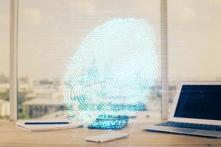 Computer on desktop in office with finger print drawing. Double exposure. Concept of business data...