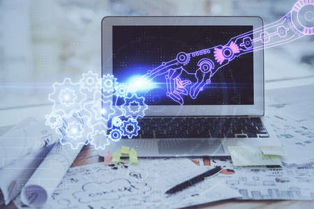 Double exposure of desktop computer and technology theme hologram. Concept of software development.