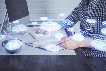 Social network theme hologram with businessman working on computer on background. Concept of world wide web. Double exposure.の写真素材