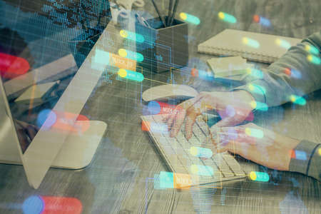 Double exposure of tech drawings with hands working on computer background. Concept of innovation.