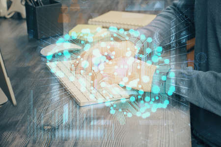 Man with computer background with brain theme hologram. Concept of brainstorm. Double exposure.