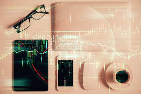 Multi exposure of financial chart hologram over desktop with phone. Top view. Mobile trade platform...