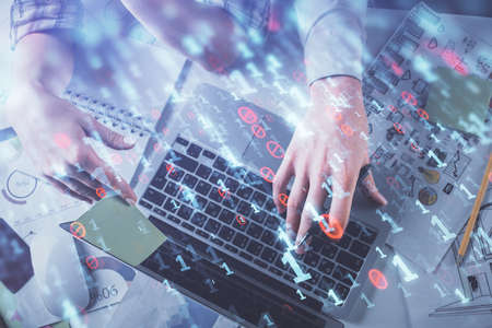 Double exposure of man and woman working together and data theme hologram drawing. Computer...