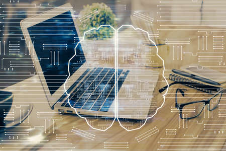 Double exposure of desktop with computer and brain drawing hologram. Artificial intelligence...