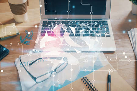 Double exposure of desktop computer and human brain drawing hologram. Ai concept.