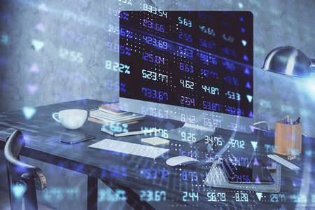 Financial chart drawing and table with computer on background. Multi exposure. Concept of...