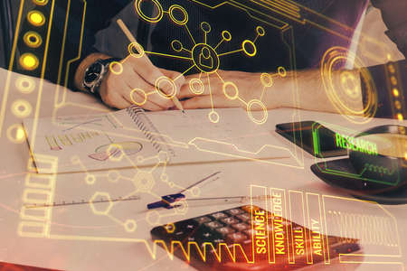 Man's hands with technology theme multi exposure icons. Concept of big data.の写真素材