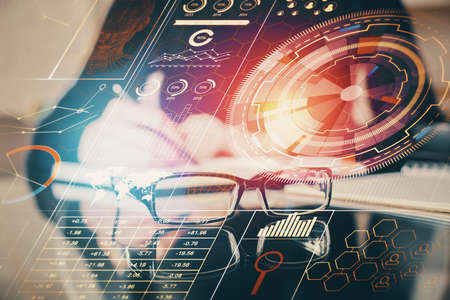 Double exposure of writing hands on background with data solution hologram on front. Technology...