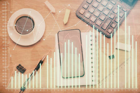 Multi exposure of forex graph hologram over desktop with phone. Top view. Mobile trade platform concept.の写真素材