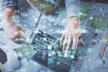 Double exposure of man and woman working together and data theme hologram drawing. Computer...