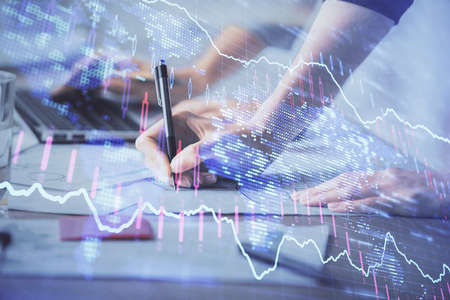 Multi exposure of woman hands typing on computer and financial chart hologram drawing. Stock market...