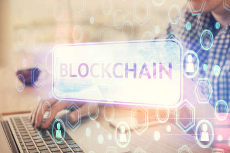 Double exposure of man hands holding a credit card and crypto business theme drawing. Digital...