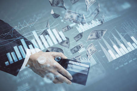 Multi exposure of financial graph drawing hologram and USA dollars bills and man hands. Analysis...