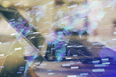 Double exposure of table with computer on background and data theme hologram. Data technology concept.の写真素材