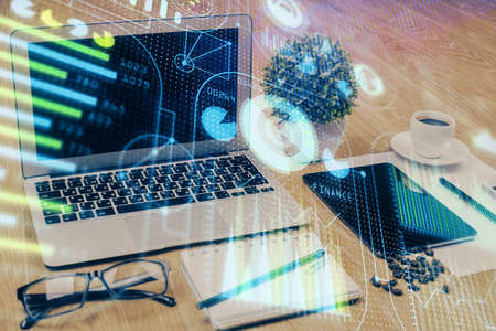 Double exposure of table with computer on background and data theme drawing. Concept of innovation.