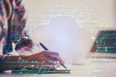Double exposure of woman's writing hand on background with data technology hud. Big data concept.