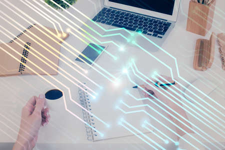 Double exposure of writing hand on background with data technology hologram. Big data concept.