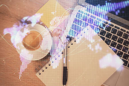 Business theme hologram drawings over computer on the desktop background. Top view. Multi exposure. Concept of international connections.の写真素材