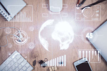 Multi exposure of forex graph hologram over desktop with phone. Top view. Mobile trade platform...