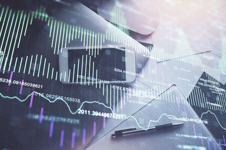 Multi exposure of forex graph hologram over desktop with phone. Top view. Mobile trade platform...