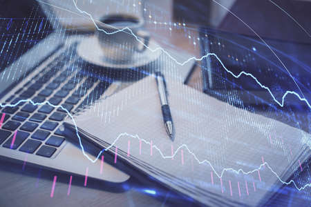 Double exposure of forex chart drawing and desktop with coffee and items on table background....